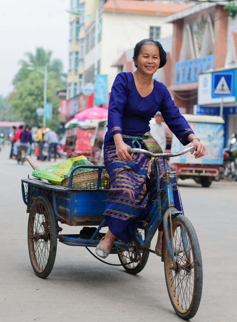 Chinese woman cycles to the market