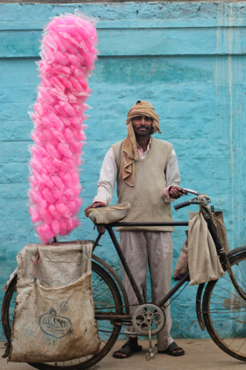 Cotton candy is carried on a bicycle in Northern India