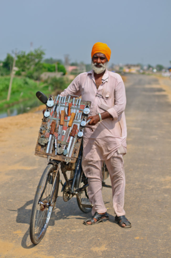 A cycling knife and lock salesman in India.