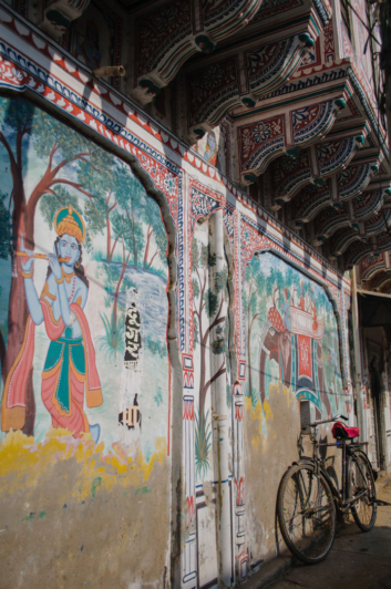 A bicycle leans against the wall in Shekhawati, India.