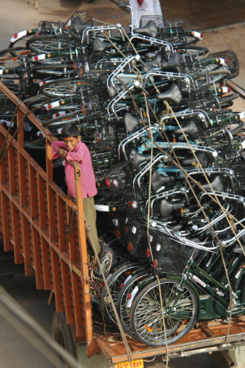 A truck full of bicycles in India.