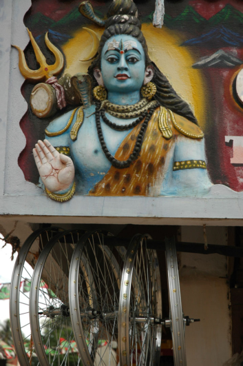 Shiva blesses bicycle rims.