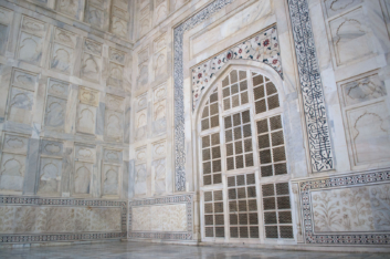 Taj mahal white marble arched grate.