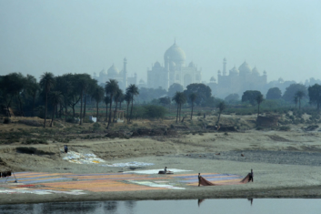 Saris are layed to dry in front of the Taj Mahal