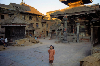 A little girl walks through a square in Bhaktapur, Nepal.