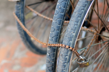 Bicycle wheels are locked up with a chain in Nepal.