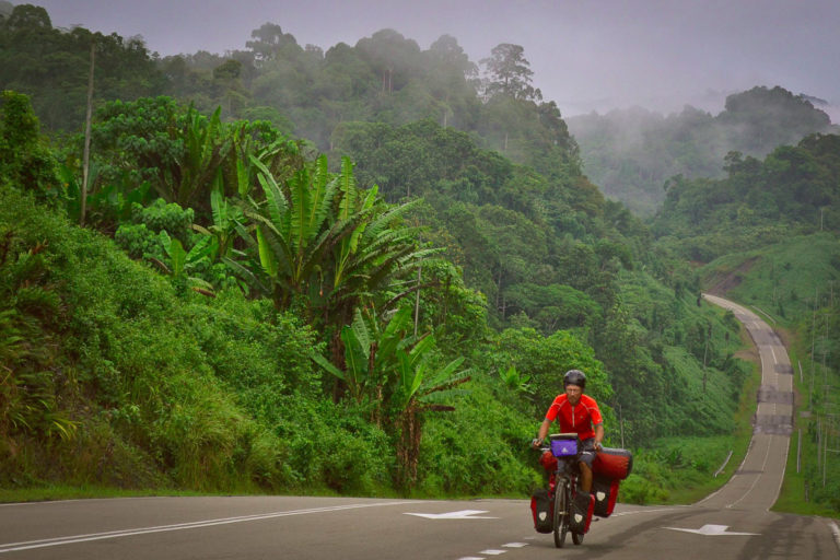 Amaya Williams and Eric Schambion cycling in Borneo