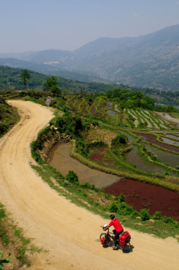 Cycling alongside terraced rice fields in Southern China