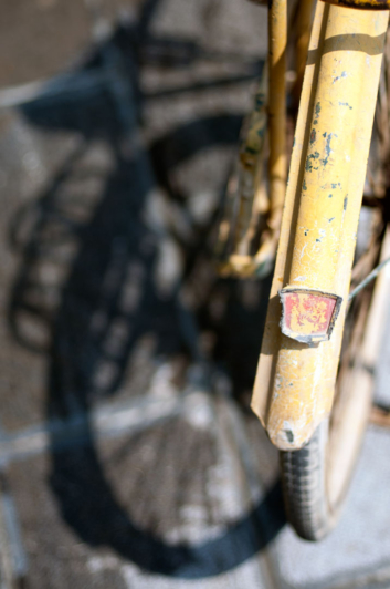 A yellow bicycle fender.