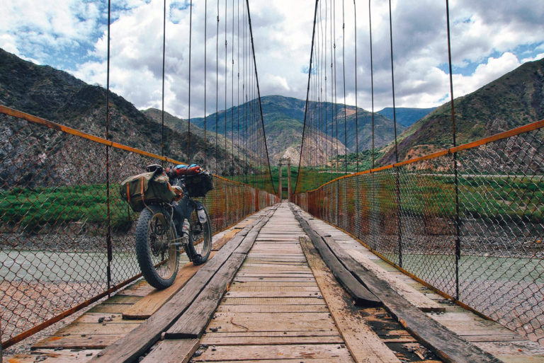 Mike Howarth's bike leans against a bridge in Peru.