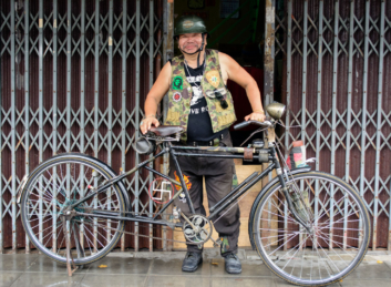 A Thai cyclist with his decorated bicycle.