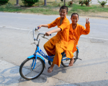 Cycling young monks in Thailand