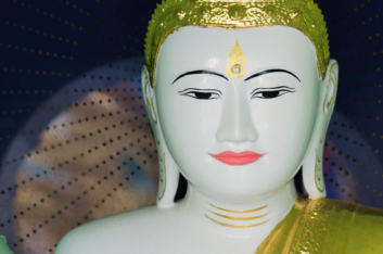 A white Buddha statue in Myanmar.