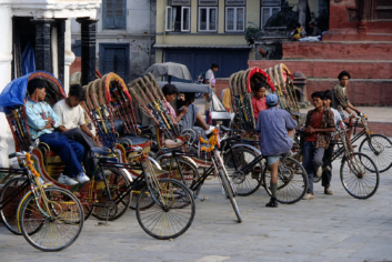 Rickshaw chauffeurs wait for passengers in Kathmandu.