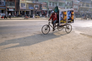 A rickshaw blares out film music in Nepal.