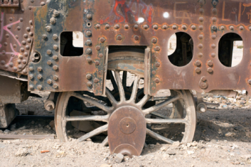 A train wheel is buried in sand in Uyuni, Bolivia.