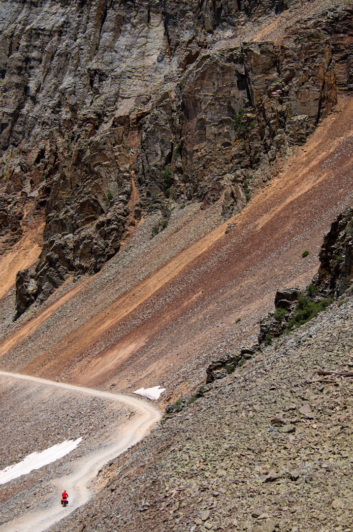A bicycle heads down Ophir Pass