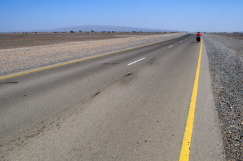 Cycling a deserted highway in Oman