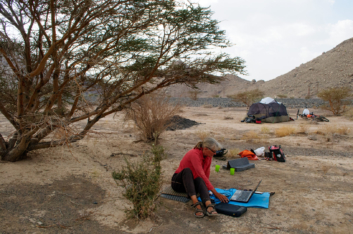 Starting up the computer while wild camping in Oman.