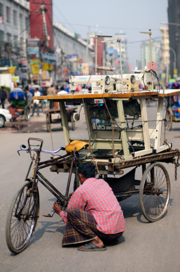 A rickshaw loaded with sewing machines in Dhaka.