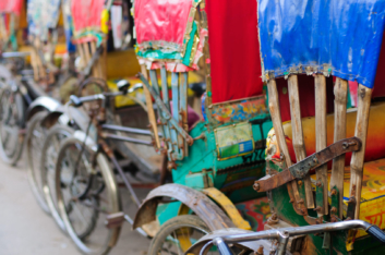 Colorful parked rickshaws in Dhaka.